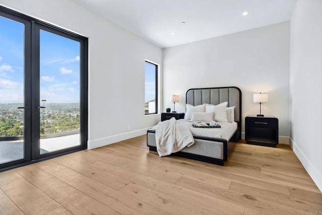9355 Lavell St, La Mesa, CA 91941 - bedroom with light wood-type flooring, access to outside, recessed lighting, and french doors