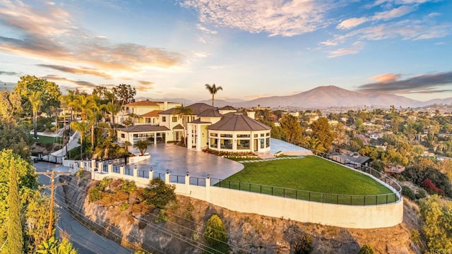 9355 Lavell St, La Mesa, CA 91941 - back of property at dusk with a fenced backyard, a patio, and a mountain view