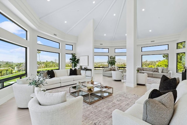 9355 Lavell St, La Mesa, CA 91941 - living area featuring high vaulted ceiling, plenty of natural light, beamed ceiling, wood finished floors, and recessed lighting