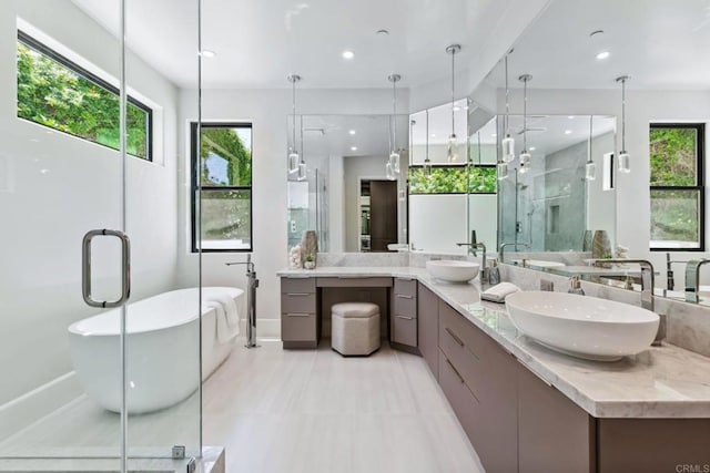 9355 Lavell St, La Mesa, CA 91941 - bathroom with double vanity, a soaking tub, healthy amount of natural light, a stall shower, and recessed lighting
