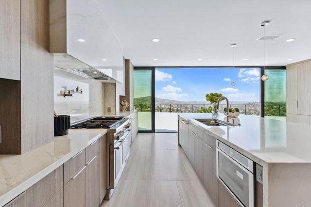 9355 Lavell St, La Mesa, CA 91941 - kitchen featuring modern cabinets, stainless steel appliances, light stone counters, and recessed lighting