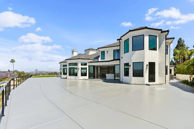 9355 Lavell St, La Mesa, CA 91941 - rear view of house featuring stucco siding and a patio