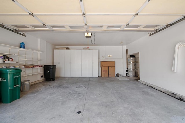 12672 Carmel Country Rd Unit 51, San Diego, CA 92130 - garage featuring secured water heater and a garage door opener