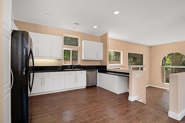 12672 Carmel Country Rd Unit 51, San Diego, CA 92130 - kitchen with freestanding refrigerator, dishwasher, dark wood-style flooring, white cabinets, and dark countertops