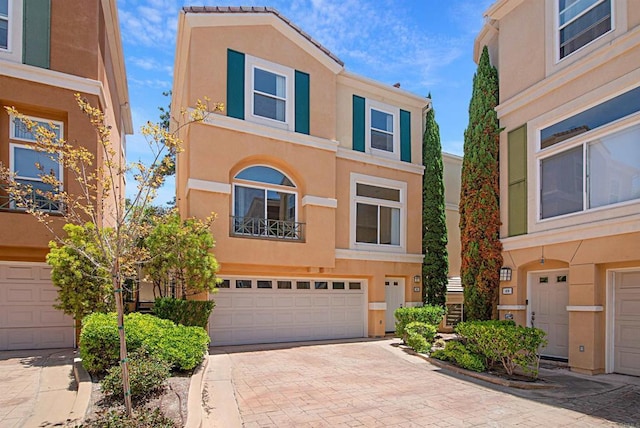 12672 Carmel Country Rd Unit 51, San Diego, CA 92130 - multi unit property with a garage, stucco siding, and decorative driveway