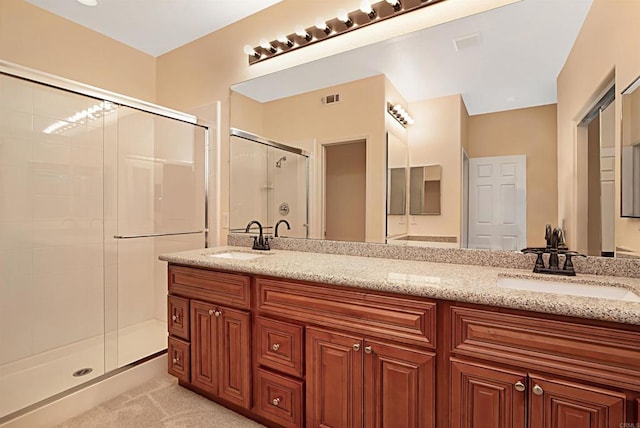 12672 Carmel Country Rd Unit 51, San Diego, CA 92130 - bathroom featuring a shower stall and double vanity