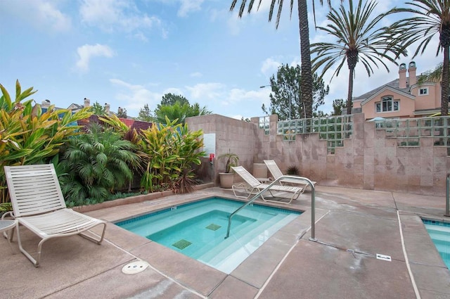 12672 Carmel Country Rd Unit 51, San Diego, CA 92130 - view of pool with a pool, a hot tub, and a patio