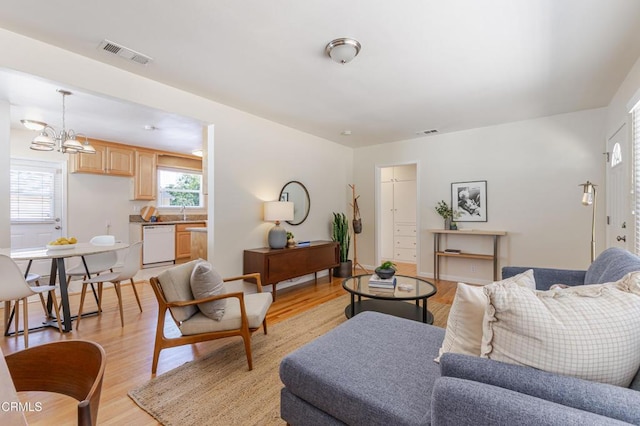 1500 E Topeka St, Pasadena, CA 91104 - living area with light wood-style floors and a chandelier