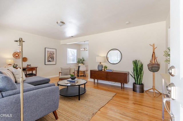 1500 E Topeka St, Pasadena, CA 91104 - living area featuring light wood-type flooring and a chandelier