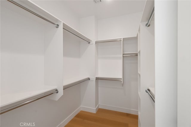 6023 Kauffman Ave, Temple City, CA 91780 - walk in closet with light wood-style flooring