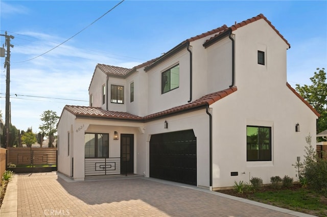 6023 Kauffman Ave, Temple City, CA 91780 - mediterranean / spanish-style home featuring a tile roof, an attached garage, and stucco siding
