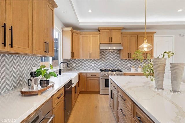 6023 Kauffman Ave, Temple City, CA 91780 - kitchen with stainless steel appliances, under cabinet range hood, light wood finished floors, pendant lighting, and recessed lighting