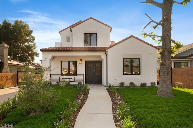 6023 Kauffman Ave, Temple City, CA 91780 - mediterranean / spanish-style home with a tile roof, stucco siding, covered porch, and french doors