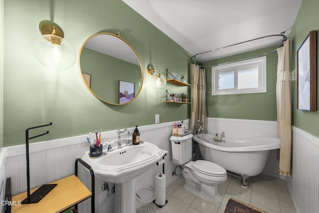 527 Keyser Rondo, Camarillo, CA 93010 - bathroom with wainscoting, a freestanding bath, and tile patterned flooring