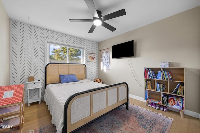527 Keyser Rondo, Camarillo, CA 93010 - bedroom featuring an accent wall, wood finished floors, and ceiling fan