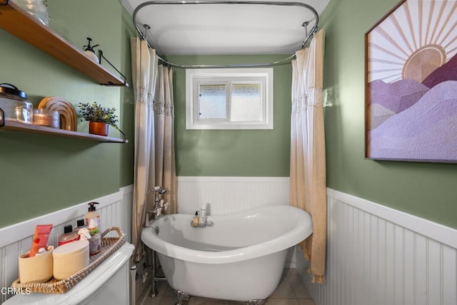 527 Keyser Rondo, Camarillo, CA 93010 - bathroom featuring wainscoting, a soaking tub, and tile patterned flooring