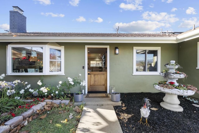 527 Keyser Rondo, Camarillo, CA 93010 - doorway to property with stucco siding and a chimney