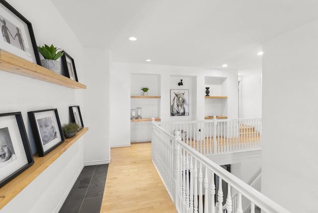 1480 Regatta Rd, Carlsbad, CA 92011 - hallway featuring built in shelves, recessed lighting, and an upstairs landing