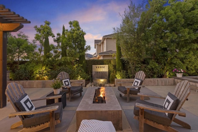1480 Regatta Rd, Carlsbad, CA 92011 - patio terrace at dusk with an outdoor fire pit and a patio area