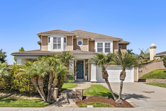1480 Regatta Rd, Carlsbad, CA 92011 - view of front facade featuring concrete driveway, an attached garage, and a tiled roof