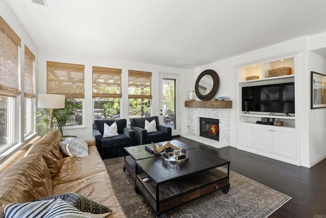 1480 Regatta Rd, Carlsbad, CA 92011 - living area with a stone fireplace, dark wood-type flooring, and built in features