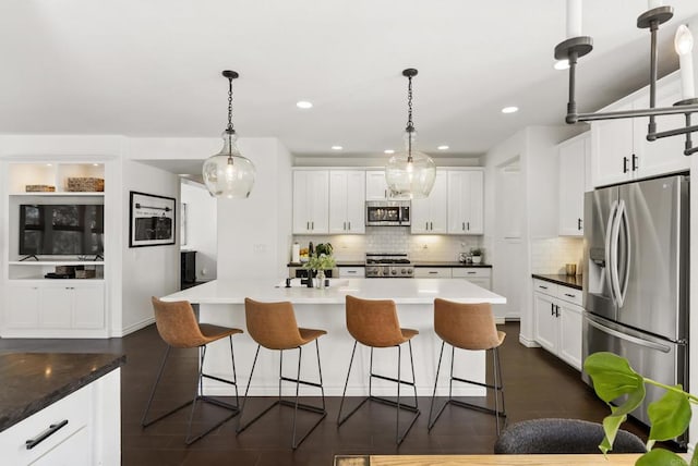 1480 Regatta Rd, Carlsbad, CA 92011 - kitchen with stainless steel appliances, tasteful backsplash, white cabinetry, a kitchen breakfast bar, and recessed lighting
