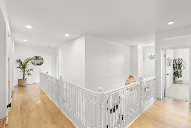 1480 Regatta Rd, Carlsbad, CA 92011 - hall with an upstairs landing, light wood-style floors, and recessed lighting