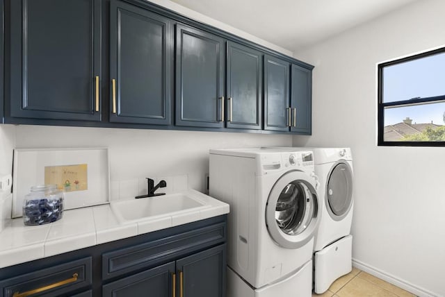 1480 Regatta Rd, Carlsbad, CA 92011 - washroom featuring cabinet space, separate washer and dryer, and light tile patterned floors