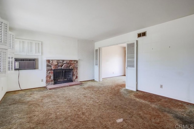 1970 El Prado Ave, Lemon Grove, CA 91945 - unfurnished living room with carpet, a stone fireplace, and a wall unit AC