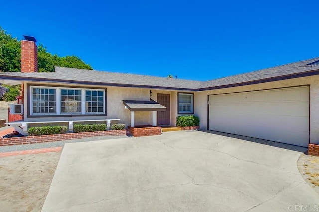 1970 El Prado Ave, Lemon Grove, CA 91945 - ranch-style home with stucco siding, concrete driveway, a chimney, a garage, and roof with shingles