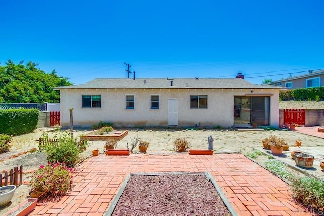 1970 El Prado Ave, Lemon Grove, CA 91945 - rear view of property with stucco siding and a patio area