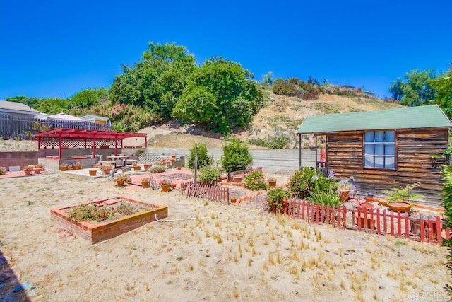 1970 El Prado Ave, Lemon Grove, CA 91945 - fenced backyard featuring a vegetable garden and an outdoor structure