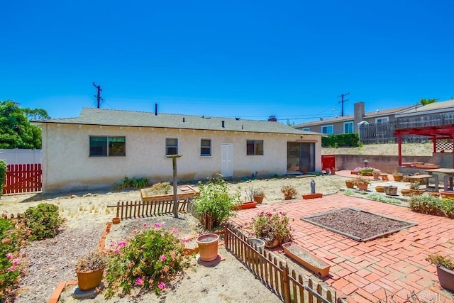 1970 El Prado Ave, Lemon Grove, CA 91945 - rear view of house with stucco siding and a patio area