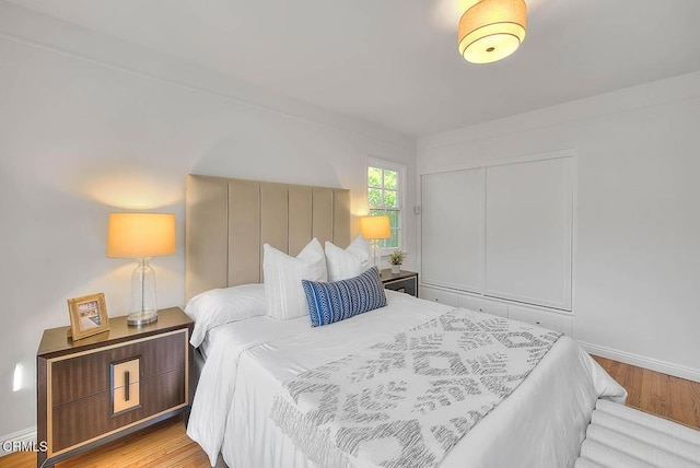 3671 Grayburn Rd, Pasadena, CA 91107 - bedroom featuring wood finished floors and a closet