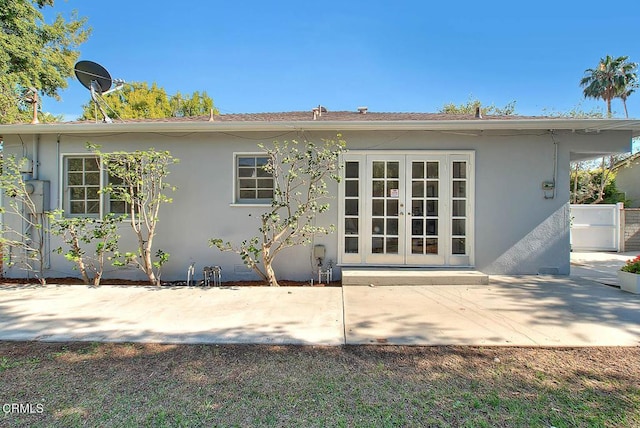 3671 Grayburn Rd, Pasadena, CA 91107 - rear view of house with french doors, a patio, and stucco siding