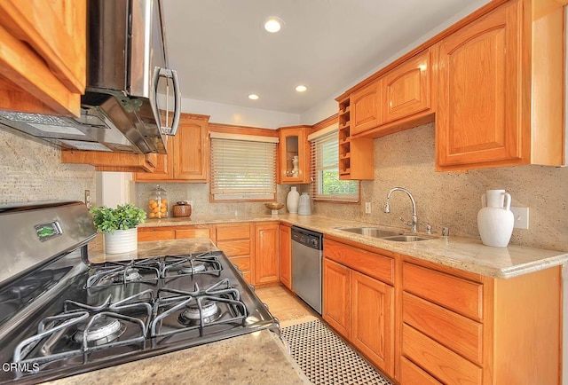 3671 Grayburn Rd, Pasadena, CA 91107 - kitchen with appliances with stainless steel finishes, backsplash, recessed lighting, glass insert cabinets, and light stone countertops