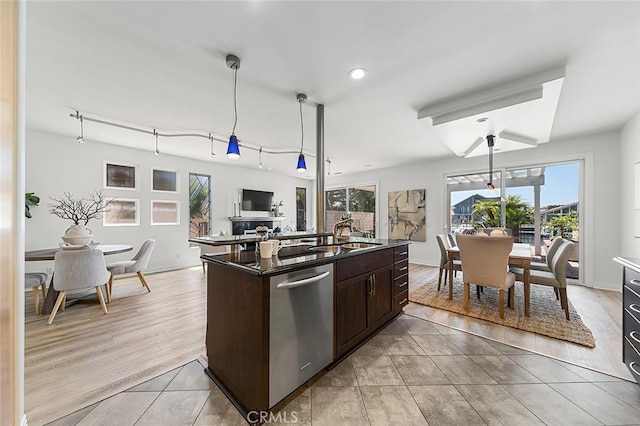3496 Windspun, Huntington Beach, CA 92649 - kitchen featuring stainless steel dishwasher, plenty of natural light, dark countertops, dark brown cabinets, and recessed lighting