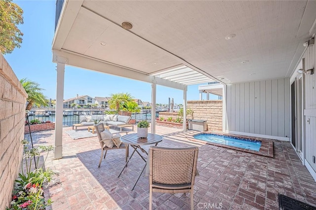 3496 Windspun, Huntington Beach, CA 92649 - view of patio featuring an outdoor hot tub, an outdoor hangout area, and a water view