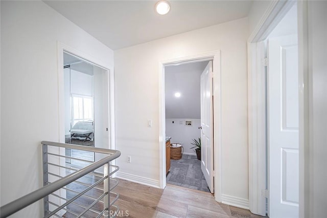 3496 Windspun, Huntington Beach, CA 92649 - corridor featuring light wood finished floors and baseboards