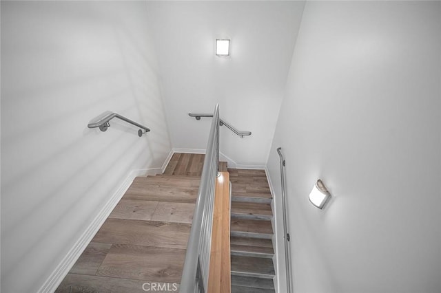 3496 Windspun, Huntington Beach, CA 92649 - stairway featuring wood finished floors and baseboards