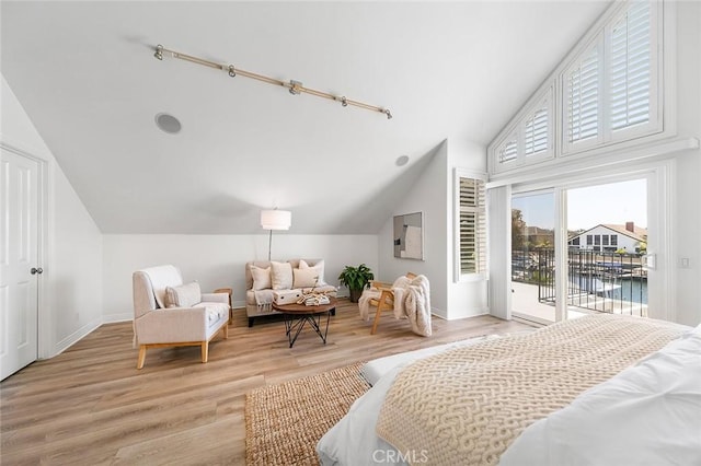 3496 Windspun, Huntington Beach, CA 92649 - bedroom featuring vaulted ceiling, access to exterior, light wood-style floors, and a water view