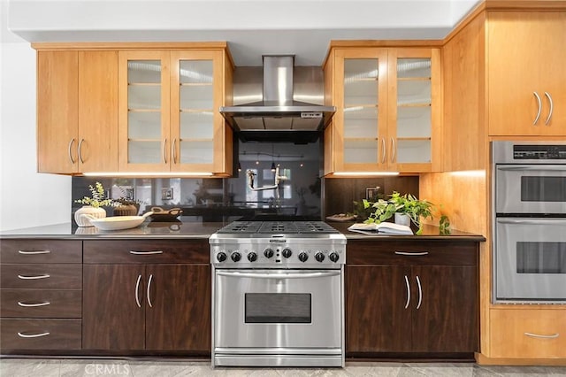 3496 Windspun, Huntington Beach, CA 92649 - kitchen featuring stainless steel appliances, extractor fan, glass insert cabinets, dark brown cabinetry, and tasteful backsplash