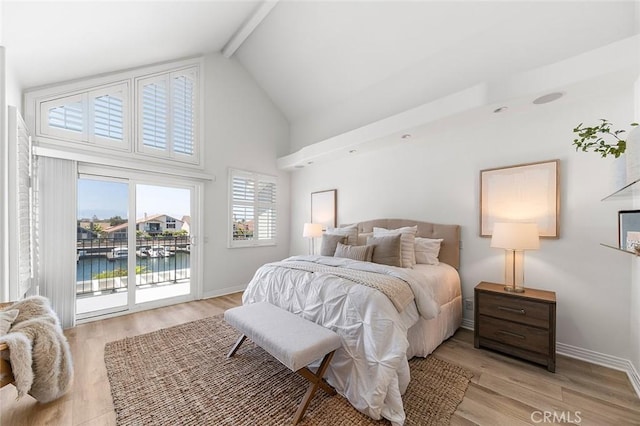 3496 Windspun, Huntington Beach, CA 92649 - bedroom featuring access to exterior, high vaulted ceiling, beam ceiling, light wood finished floors, and a water view