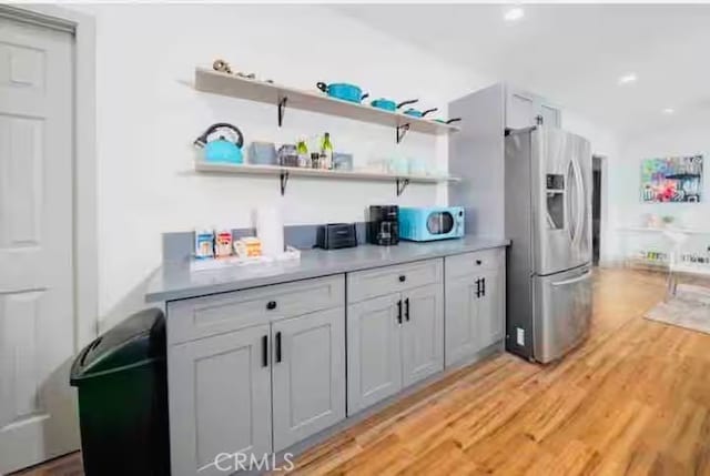 5743 Magnolia Ave, Riverside, CA 92506 - kitchen featuring appliances with stainless steel finishes, light wood-style flooring, light countertops, open shelves, and recessed lighting