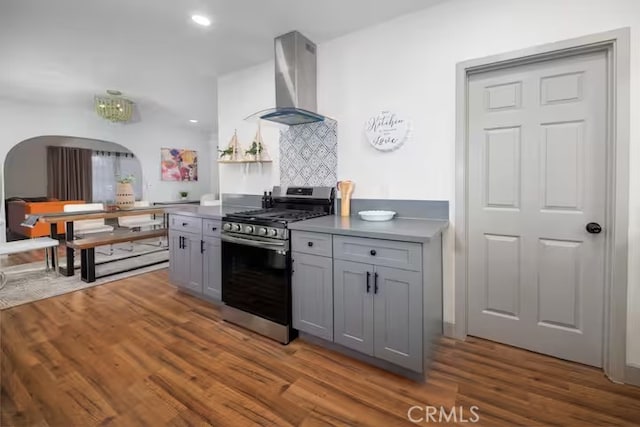 5743 Magnolia Ave, Riverside, CA 92506 - kitchen with stainless steel range with gas stovetop, range hood, gray cabinetry, wood finished floors, and recessed lighting