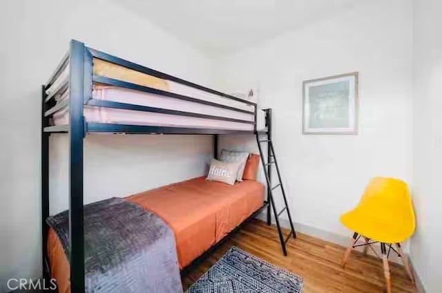 5743 Magnolia Ave, Riverside, CA 92506 - bedroom with wood finished floors and baseboards