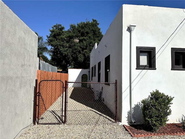 5743 Magnolia Ave, Riverside, CA 92506 - view of side of home with a gate and stucco siding