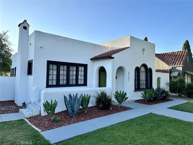 5743 Magnolia Ave, Riverside, CA 92506 - mediterranean / spanish house featuring stucco siding and a front yard