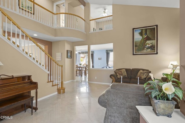 1776 Marsala Way, Camarillo, CA 93012 - living room with ceiling fan, stairway, tile patterned flooring, and a towering ceiling