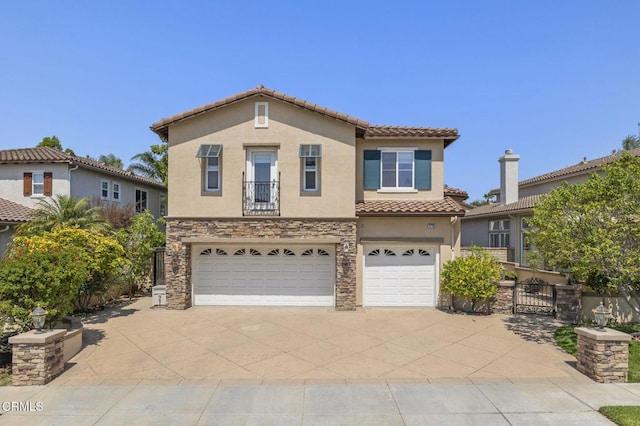 1776 Marsala Way, Camarillo, CA 93012 - mediterranean / spanish home featuring stucco siding, an attached garage, driveway, a tile roof, and stone siding
